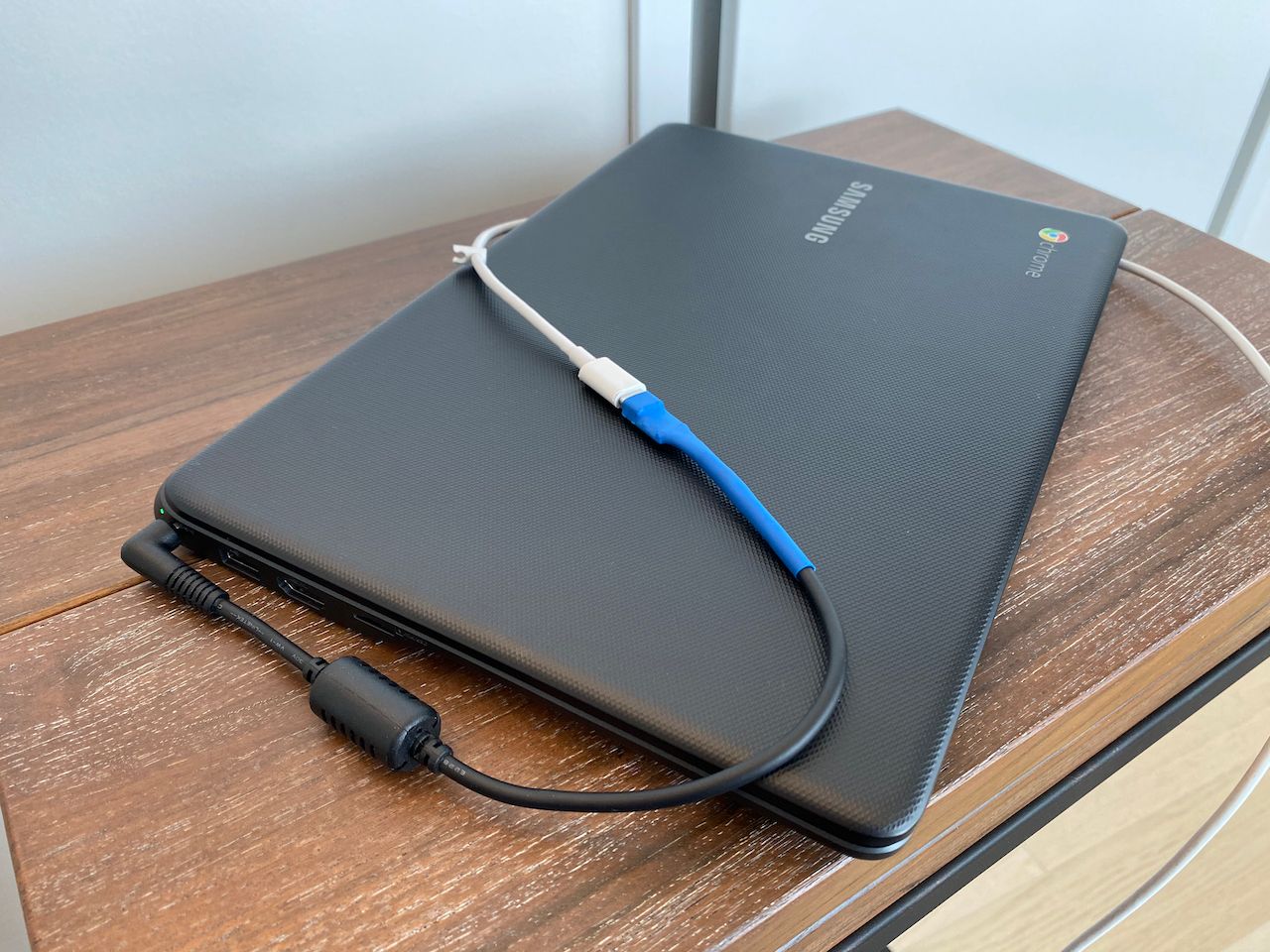 the adaptor charging a laptop